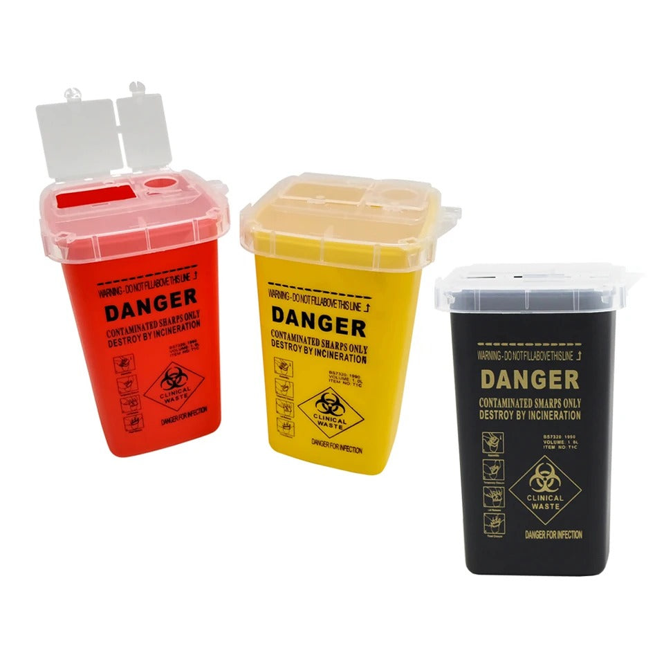 Set of red, yellow, and black biohazard containers for sharp and infectious waste disposal.