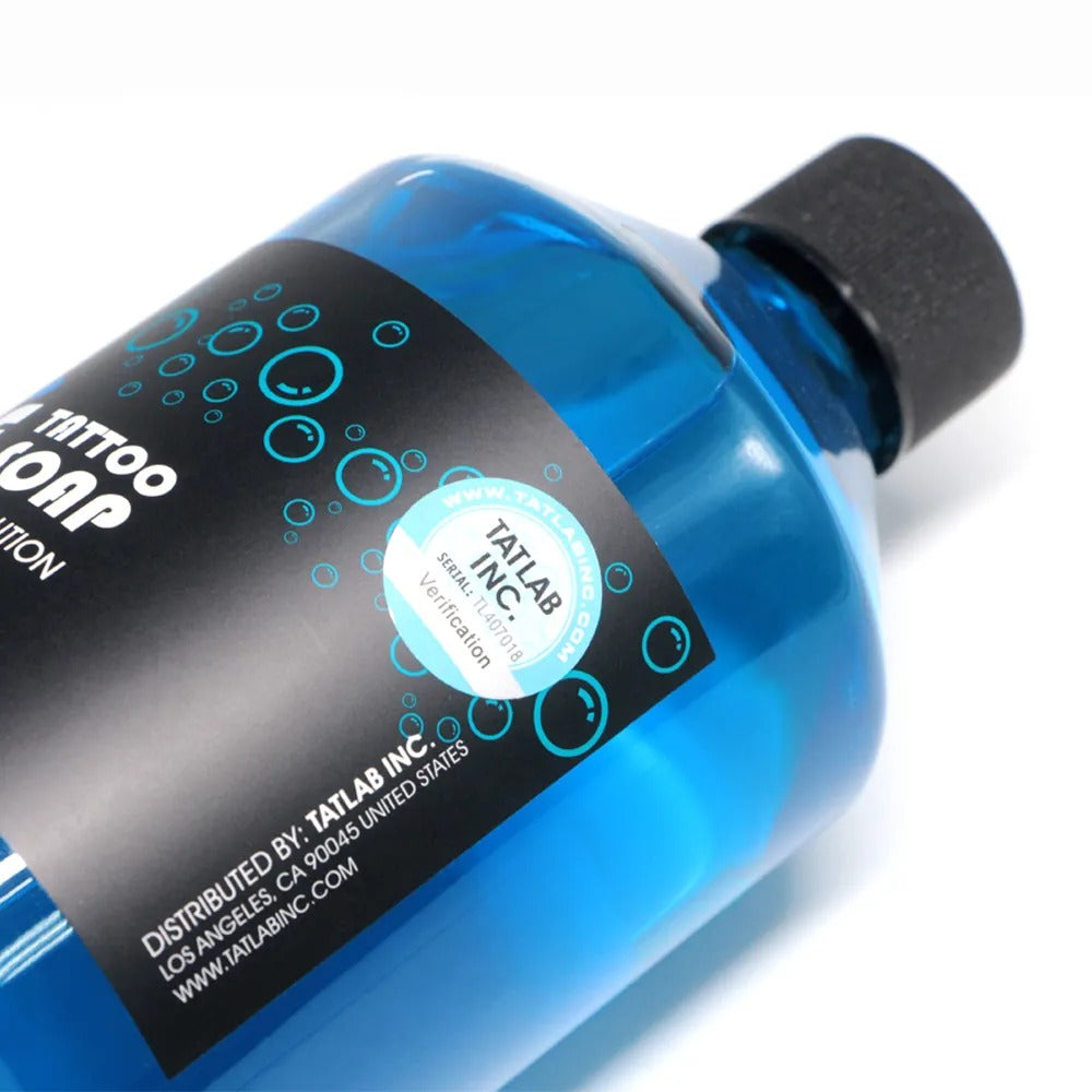 Blue Soap 500ml bottle shown from a side angle, highlighting its professional tattoo solution for skin cleansing and soothing.