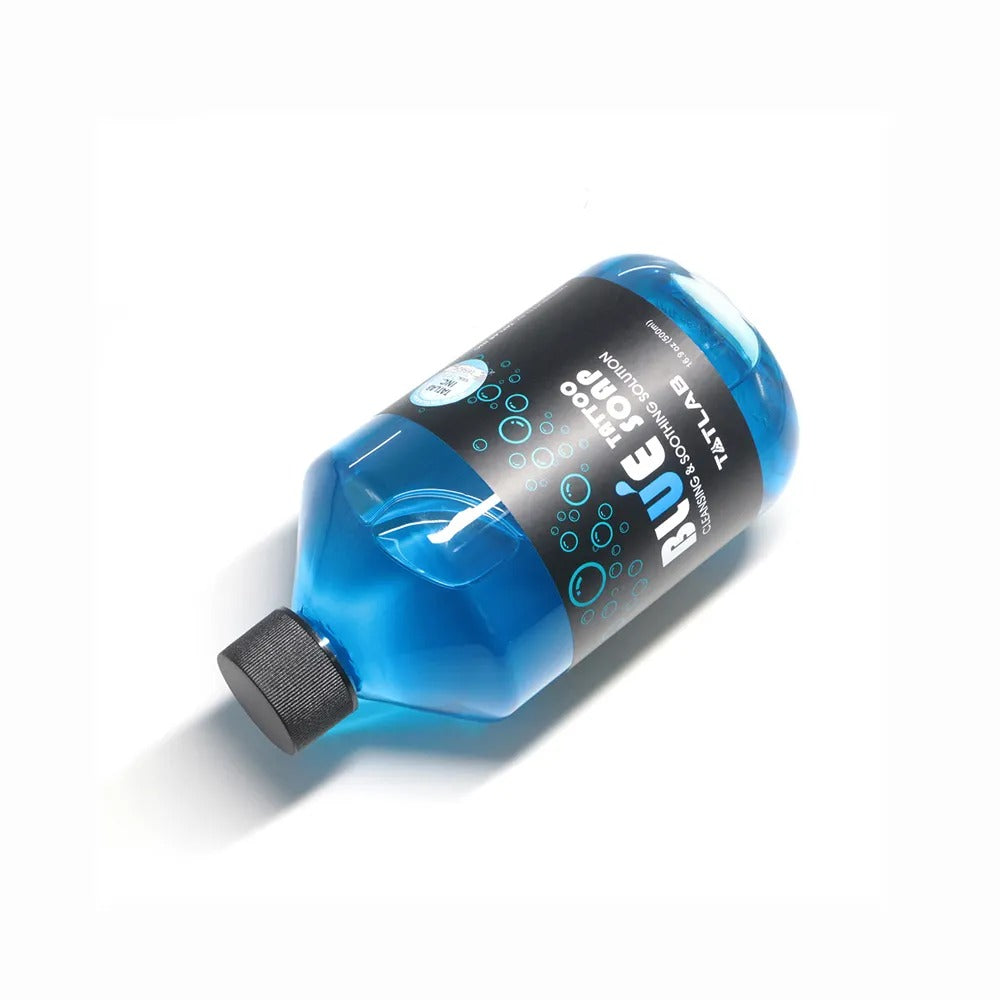 Blue Soap 500ml bottle shown from a side angle, highlighting its professional tattoo solution for skin cleansing and soothing
