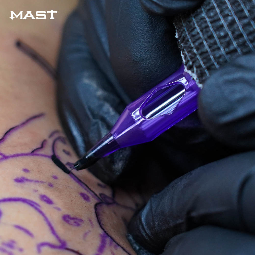 Photograph showing a Mast Pro Tattoo Cartridge in liner configuration in action. The cartridge is being used in a tattooing process, demonstrating its functionality and performance.