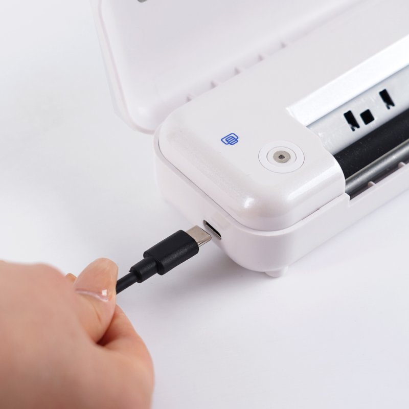 MAST Smart Wireless Printer charging process, showcasing the USB charging port for on-the-go recharging.