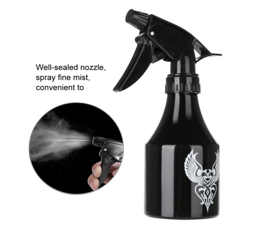 Sleek black spray bottle with ergonomic design and tribal tattoo print, ideal for cleaning tattoo studios.