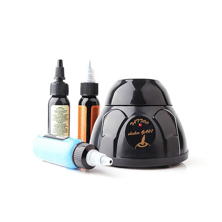 Tattoo ink mixer placed alongside multiple ink bottles, suitable for quick and efficient mixing.