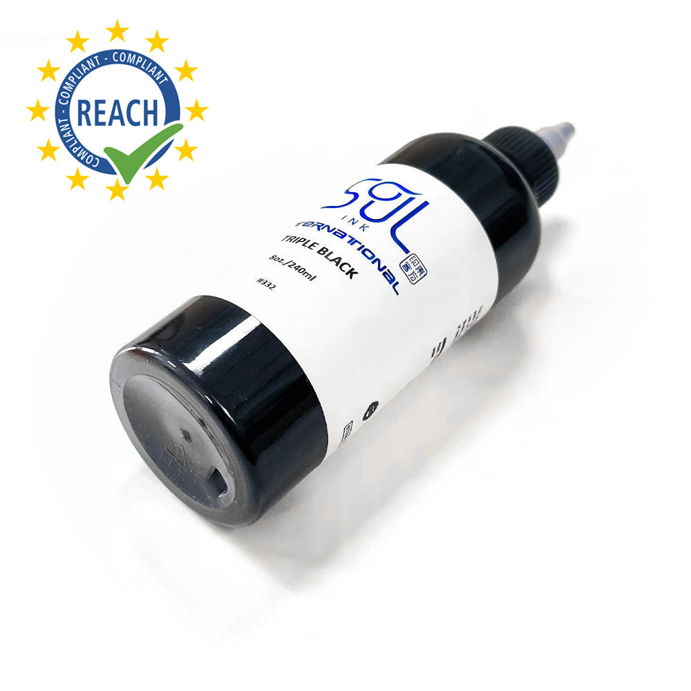 Photograph of a bottle of 'Soul Ink' brand triple black ink. The label prominently displays the brand name 'Soul Ink' in stylish blue typography against a white background. The triple black 30 ml bottle with a white label featuring the brands name 'Soul Ink'.