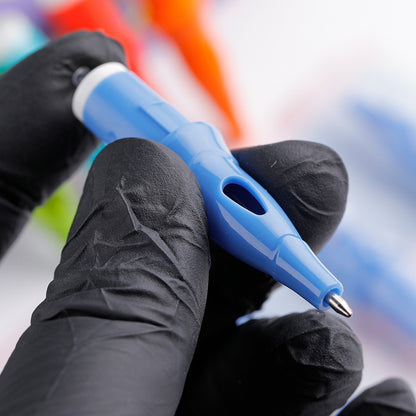 Close-up view of a blue Ball Point Cartridge Pen held with gloves, showcasing its high-quality design.