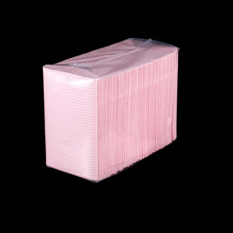 Pink disposable waterproof mats in protective packaging