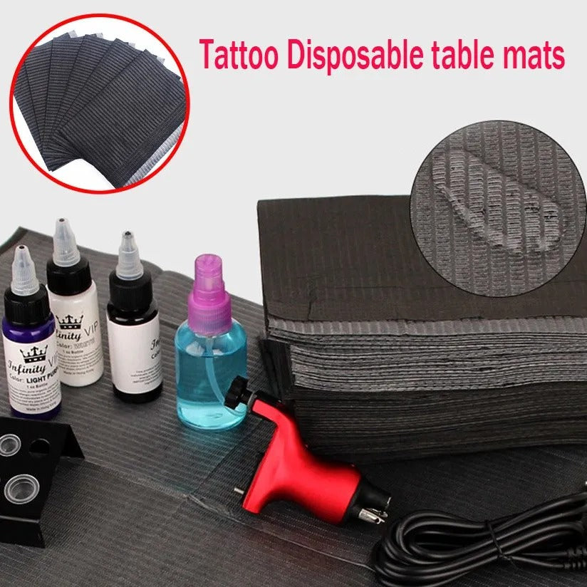 Disposable mats setup on a workstation for tattoo equipment protection

