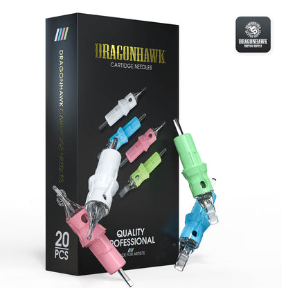 A photograph featuring a black box of Dragonhawk cartridge needles, with four cartridges arranged in front of it. The cartridges include one white round liner, one light pink round shader, one light green curved magnum, and one light blue magnum. This composition showcases the variety and quality of Dragonhawk cartridge needles.