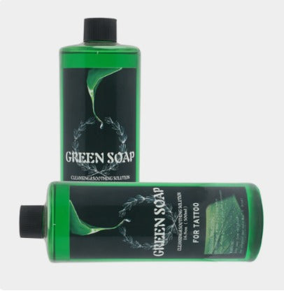 Multiple bottles of natural green soap concentrate for tattooing