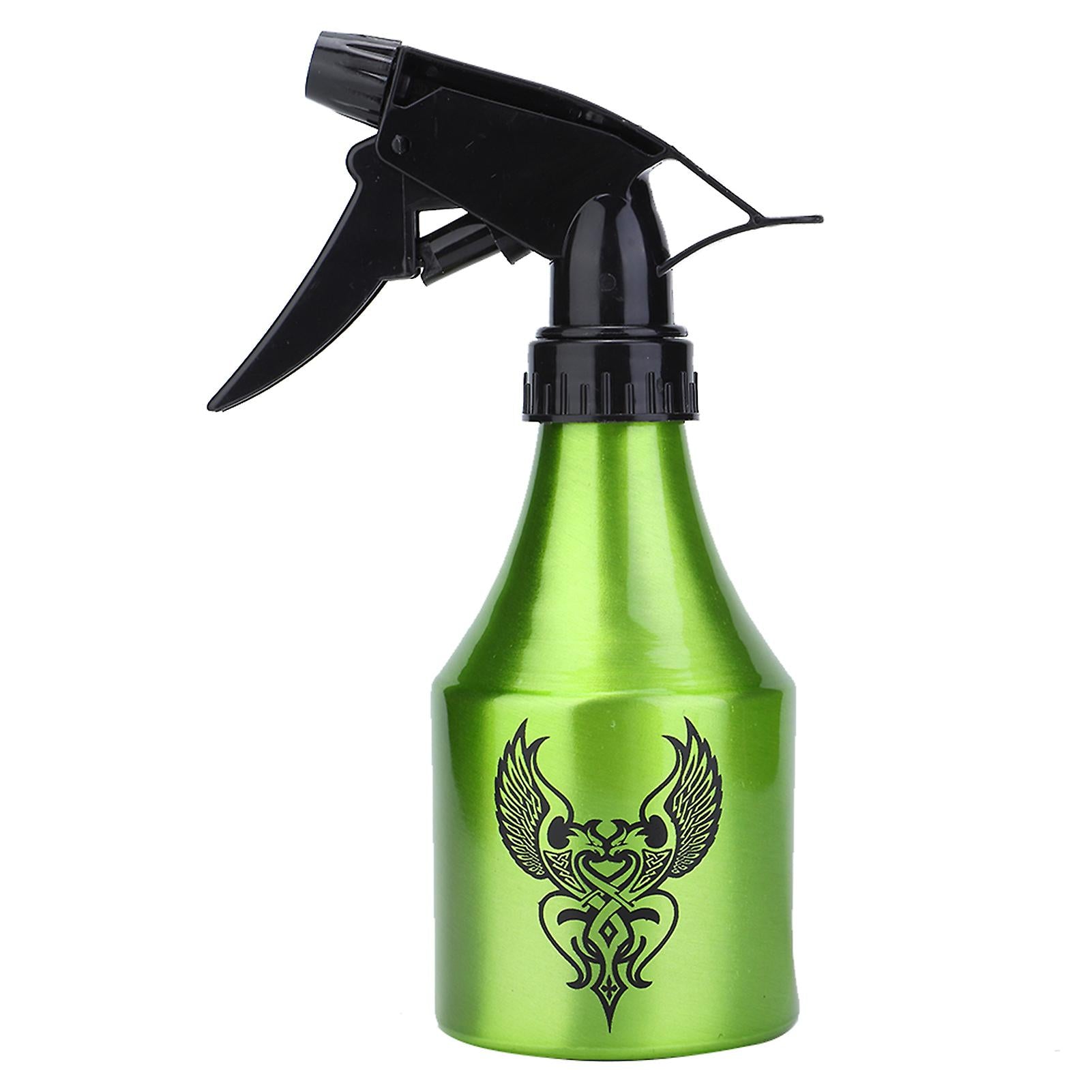 High-quality green spray bottle with adjustable nozzle and tribal tattoo design, suited for tattoo cleaning tasks.

