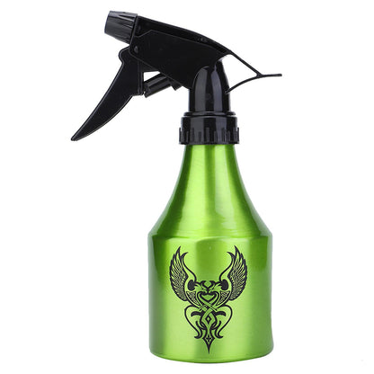 High-quality green spray bottle with adjustable nozzle and tribal tattoo design, suited for tattoo cleaning tasks.

