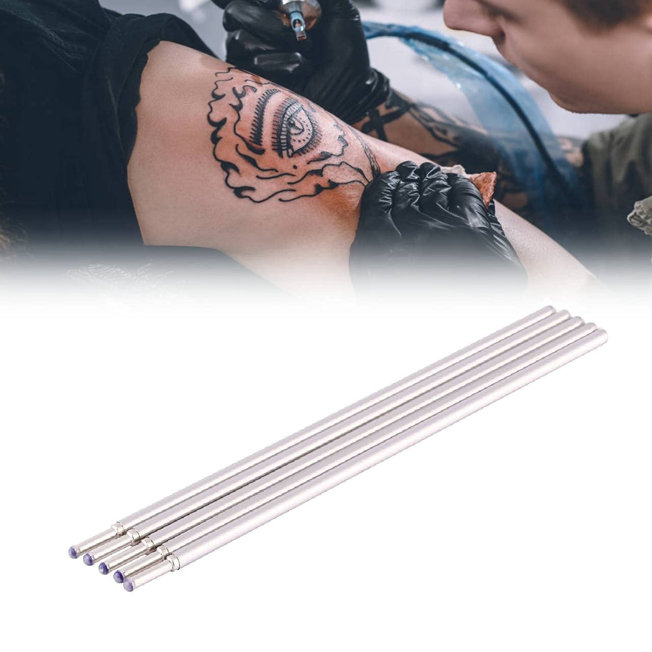 Tattoo artist using the Doodler tattoo skin pen for marking a design