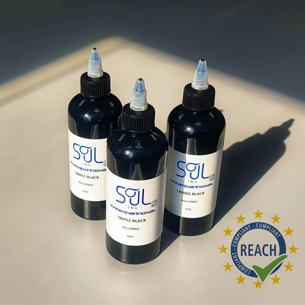 Photograph of three 'Soul Ink' brand ink bottles arranged side by side. Each bottle is black, with labels indicating the ink colors: 'Triple Black' for two bottles and 'Lining Black' for the third. The labels feature the brand name 'Soul Ink' in bold lettering against a beige background. The black caps are securely closed on each bottle, emphasizing the sleek design of the packaging.