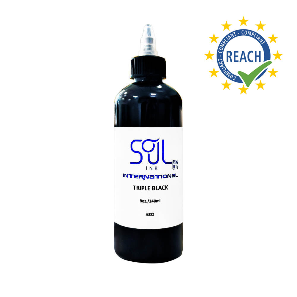 Photograph of a bottle of 'Soul Ink' brand triple black ink. The label prominently displays the brand name 'Soul Ink' in stylish blue typography against a white background. The triple black 30 ml bottle with a white label featuring the brands name 'Soul Ink'. 